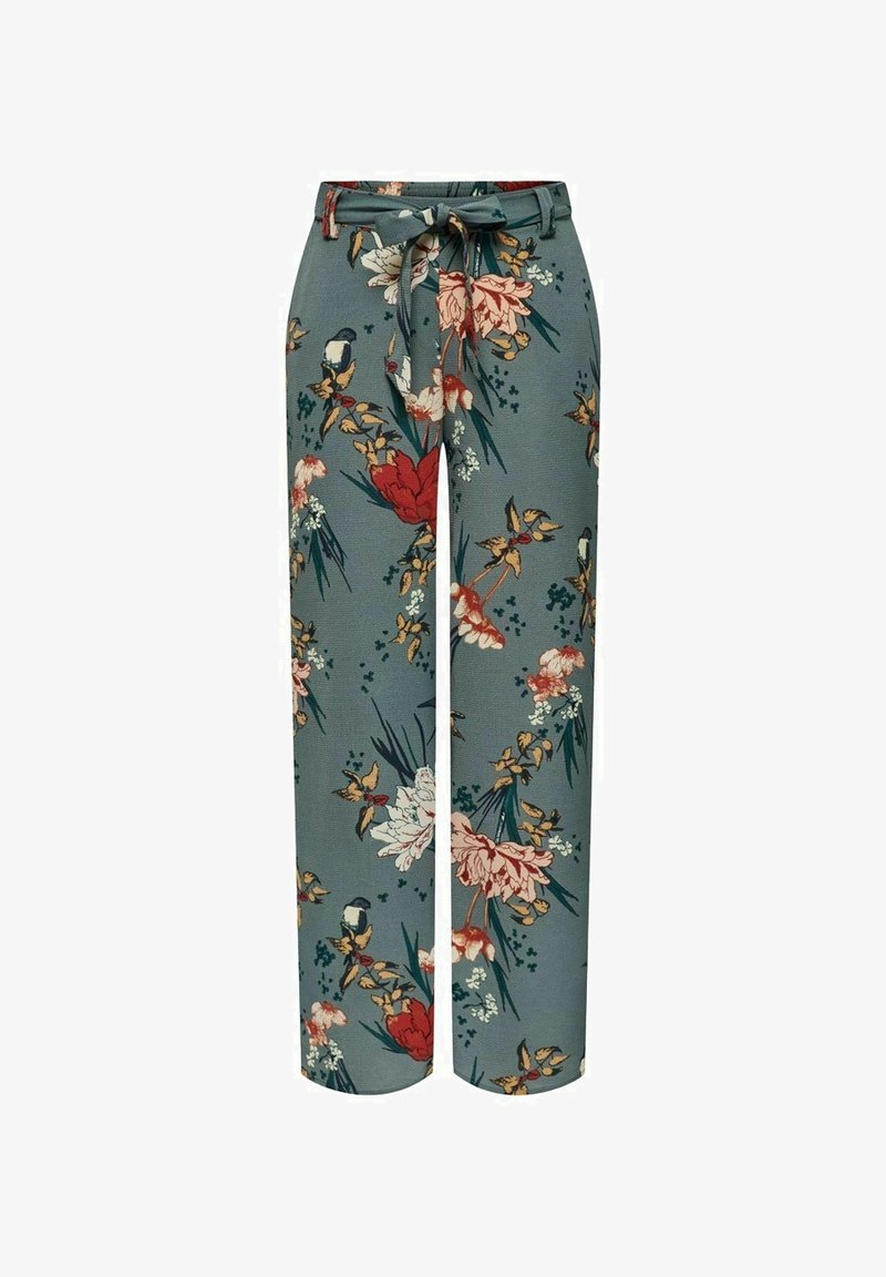 Pantalon large taille haute avec base verte, imprimé floral en rouge, blanc et jaune, et une ceinture assortie en tissu nouée à la taille.