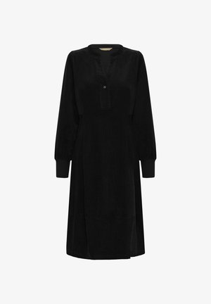Abito in corduroy nero con scollo a uomo, dettagli con bottoni, maniche lunghe e silhouette svasata. Texture liscia e design al ginocchio.