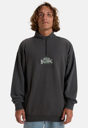 Gray pullover sweatshirt with a high collar, half zipper, and embroidered "BILLABONG" logo in white and green on the chest. Cotton blend fabric.
