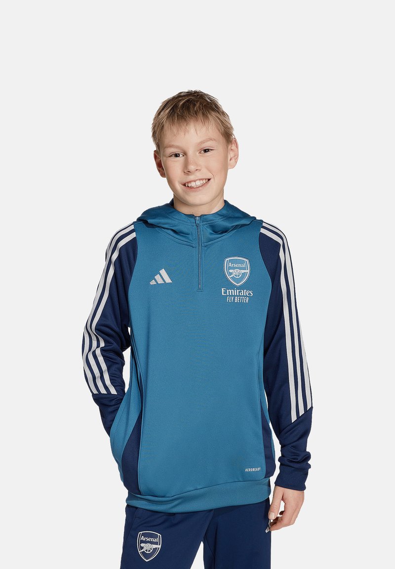 Teal sportieve hoodie met marineblauwe accenten, met een rits aan de voorkant, capuchon, gestreepte mouwen en het Arsenal-logo. Gemaakt van vochtafvoerende stof.
