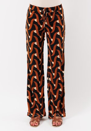Pantaloni a gamba larga in tessuto morbido, con uno sfondo nero e un motivo astratto alternato in arancione e crema. Vita con cordoncino.