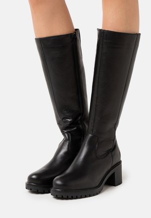 Knee-high black leather boots with a smooth texture, block heels, and a side zipper. Features a rugged sole and subtle seam detailing.