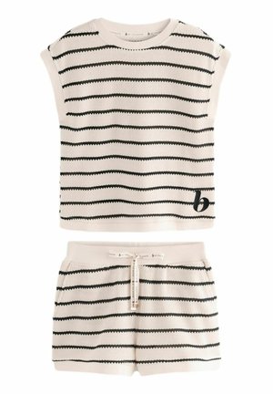 Knit two-piece set featuring a cropped, sleeveless top and matching shorts. Cream base with black horizontal stripes, textured fabric, and drawstring waist.