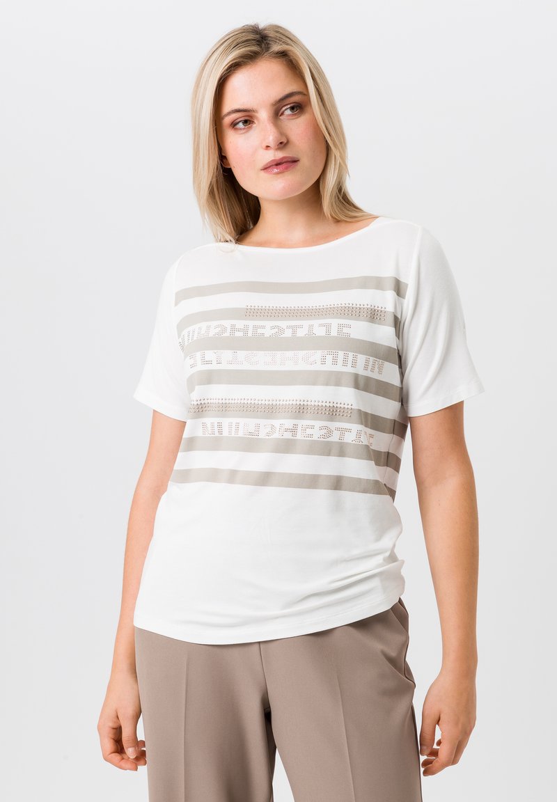 White short-sleeve t-shirt featuring gray horizontal stripes with text and punctuated designs. Soft fabric with a relaxed fit and round neckline.