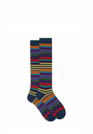 Knee-high socks featuring a colorful striped pattern with varying widths. Colors include navy, orange, red, green, and purple with dotted accents.