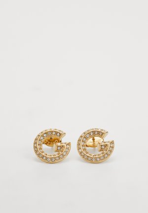 Gold-tone stud earrings featuring a signature 'G' shape adorned with clear rhinestones along the edge, with a smooth metallic finish.