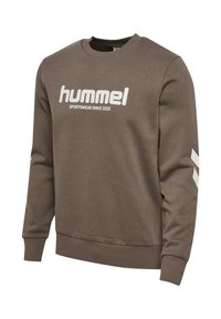Bruine sweatshirt met witte "hummel" tekst en strepen op de mouwen, gemaakt van een zachte stof met een ronde hals en geribbelde boorden.