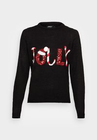 Czarny dziany sweter z napisem "JOLLY" w czerwonych cekinach i białymi akcentami, z białym pomponem z przodu. Okrągły dekolt.