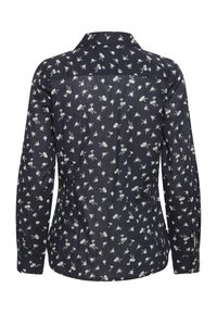 Chemise à manches longues bleu marine avec un petit imprimé floral blanc, poignets boutonnés et col classique, vue de dos.