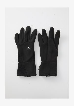 Sorte fleece vinterhansker med hvite Jumpman-logoer, teksturerte håndleddsbånd, og berøringsskjermkompatibel tommel på høyre hanske.