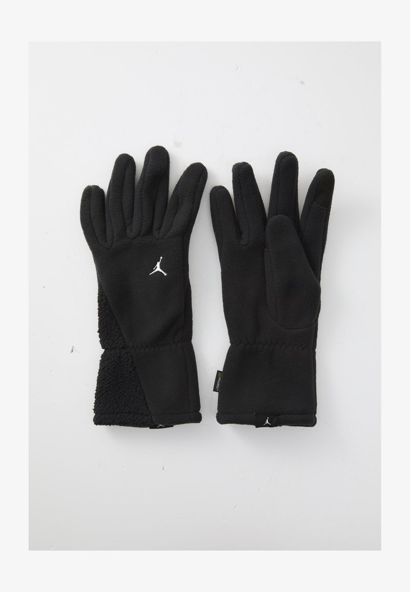 Black fleece winter gloves with white Jumpman logos, textured wrist cuffs, and touchscreen-compatible thumb on right glove.