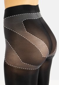 Collant neri con una finitura testurizzata, caratterizzati da cuciture bianche in un design sagomato. La vita è ampia per un maggiore comfort.