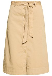 Beige cotton skirt with a tie belt, front button closure, and a straight silhouette. Features a smooth texture and clean hemline.