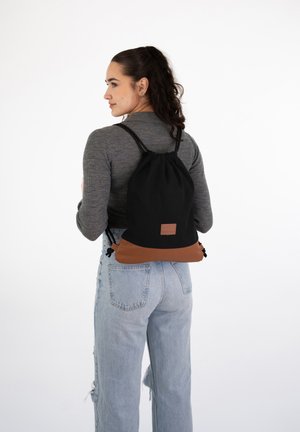 LUKE - Sports bag - black, brown