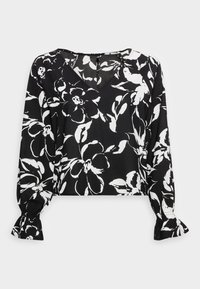 Blouse noire à motif floral avec des fleurs blanches, col en V, manches longues avec poignets froncés, longueur courte, et texture de tissu lisse.