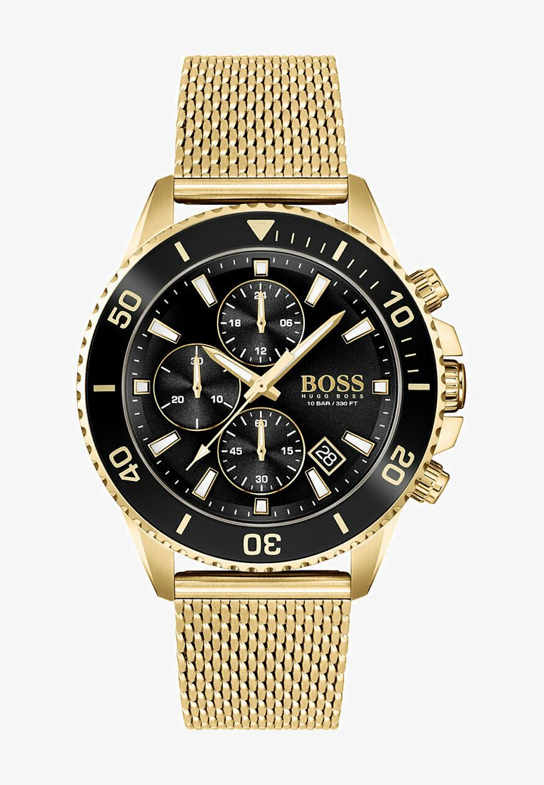 Orologio in acciaio inossidabile dorato con quadrante nero, tre sottodial, indicatori luminosi, display della data e cinturino in maglia dorata testurizzata.