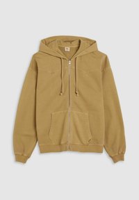 Tan zip-up hoodie met een trekkoord capuchon, voorzak in kangoeroe-stijl en geribbelde manchetten. Zachte stof met een gladde textuur en subtiele stikseldetails.