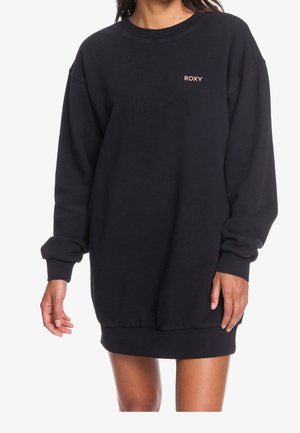 Robe sweat-shirt noire avec encolure ras-du-cou, coupe décontractée, manches longues, poignets côtelés, et petit logo Roxy rose sur la poitrine.