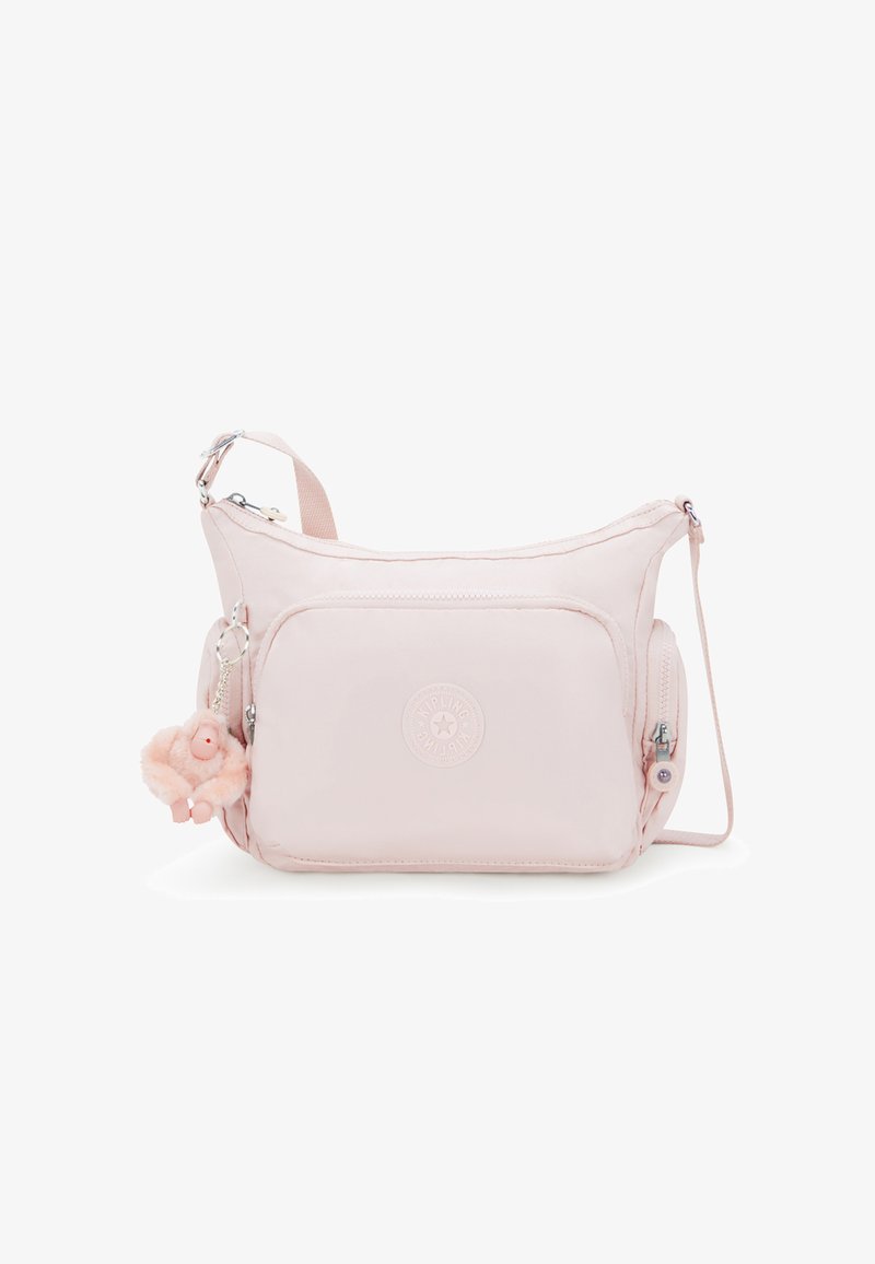 Borsa a tracolla in nylon rosa chiaro con forma arrotondata, dotata di una tasca frontale con zip, logo inciso e un portachiavi a forma di scimmia pelosa.