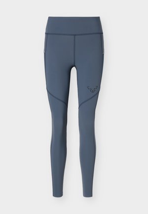 Leggings de sport gris foncé taille haute, longueur totale, coutures plates et petit logo sur le haut de la cuisse.