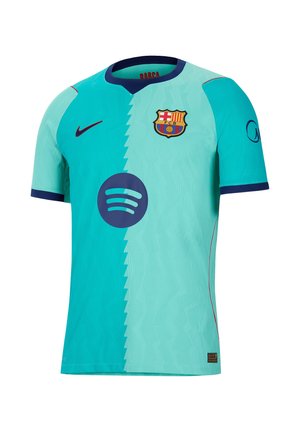 Camiseta de fútbol del FC Barcelona en dos tonos de verde azulado con ribete azul marino, logo de Nike, patrocinador Spotify y escudo del club en el pecho.