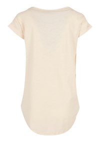 Light beige loose-fitting t-shirt with a round neckline and short rolled sleeves. Soft texture, curved hemline, and subtle sheen.