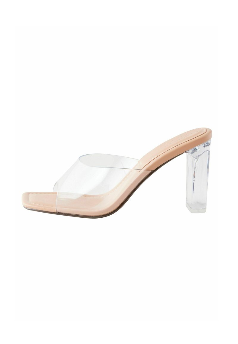 Sandale à talon transparent nu avec une lanière en plastique transparent au niveau des orteils. Présente une finition en similicuir lisse et un design à bout carré.