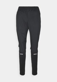 Zwarte sportbroek met een elastische tailleband, een taps toelopende pasvorm, reflecterende accenten bij de boorden en een lichtgewicht, gladde stof.