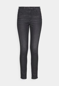 Jeans skinny de mezclilla negra de cintura alta, diseño de cinco bolsillos, textura suave y costuras sutiles a lo largo de las costuras y bolsillos.