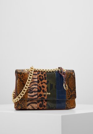 Small rectangular handbag with gold chain strap, featuring vertical animal print stripes in brown, black, green, and blue tones on a white pedestal.