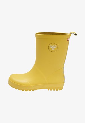 Botte de pluie en caoutchouc jaune avec un bout arrondi, une semelle texturée et un détail de logo circulaire. Présente un haut revers et une languette à l'arrière.