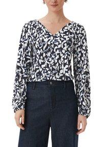 Langarmblouse met V-hals, voorzien van een abstract zwart-wit patroon met blauwe accenten. Elastische manchetten en lichtgewicht stof.