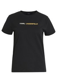 Black cotton t-shirt featuring a rounded neckline and short sleeves. "KARL" in white and "LAGERFELD" in gold printed across the chest.