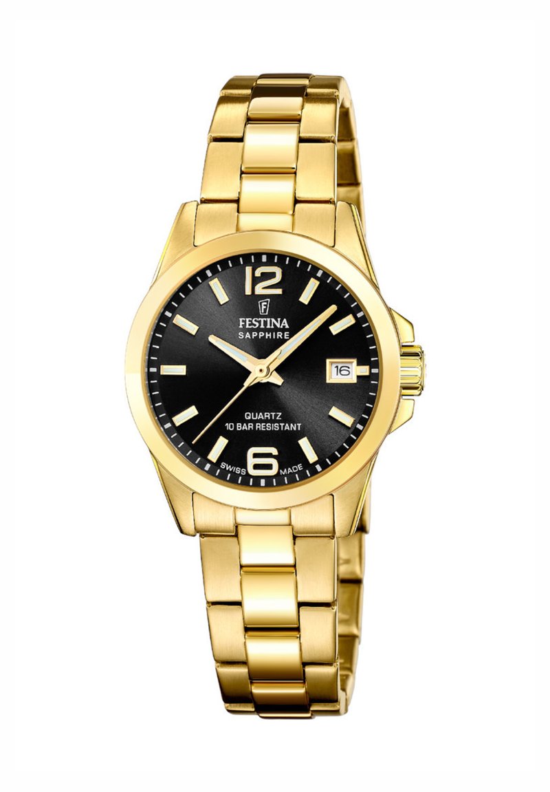 Zlatna nerjaveča jeklenka s črnim številčnico. Ima kvarčni mehanizem, prikaz datuma in svetleče kazalce. Vodoodporna do 10 barov.