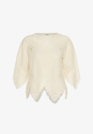 Blusa de encaje crema con dobladillo y mangas con borde festoneado, patrones florales y escote redondo.