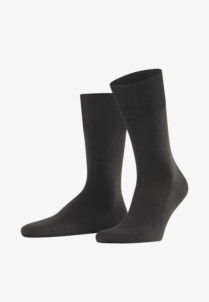 Grijze sokken met een geribde boord, gemaakt van een zacht, textuur materiaal. Middelhoge lengte met een gladde afwerking en naadloos te ontwerp.