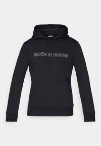 Sweat à capuche noir en tissu doux. Doté d'une poche avant, de poignets côtelés et d'une capuche avec cordon de serrage. Logo "BJÖRN BORG" en blanc.