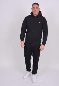 Smilodox ILYAS - Trainingsbroek - schwarz