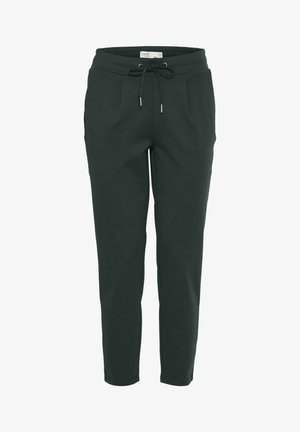 Pantaloni jogger verde scuro realizzati in tessuto morbido, con vita elastica e coulisse, tasche laterali e gambe affusolate.