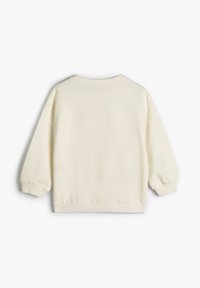 Jersey de color crema con cuello redondo, mangas largas abullonadas y puños y dobladillo acanalados, confeccionado en un tejido suave y texturizado.