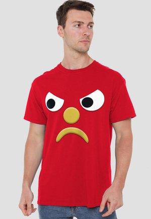 Red cotton t-shirt with a large, raised angry face design featuring white eyes and a yellow mouth and nose detail. Short sleeves and crew neck.
