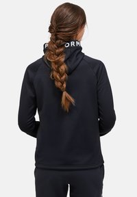 Black hooded sweatshirt with a smooth texture, featuring a white logo on the collar and a fitted design. Back view shows braided hair.