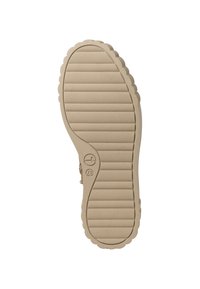 Beige rubberen schoenzool met een gestructureerd, ribbelpatroon en golvende randen. Voorzien van een logo nabij de hak en een afgeronde te ontworpen.