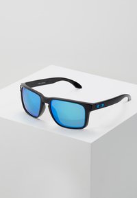 Black plastic sunglasses with large blue mirrored lenses. Features a rectangular design and blue accent on the temple for added detail.