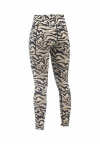 Fitted legging in een beige stof met een zwart zwervend dierenprintontwerp. Voorzien van een hoge tailleband en details van een achterzak.