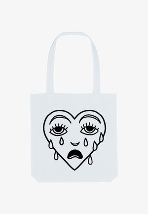 Witte tote bag met een zwart lijntekening ontwerp van een hart met twee traanvormige druppels en expressieve ogen, die een eenvoudige, platte vorm laat zien.