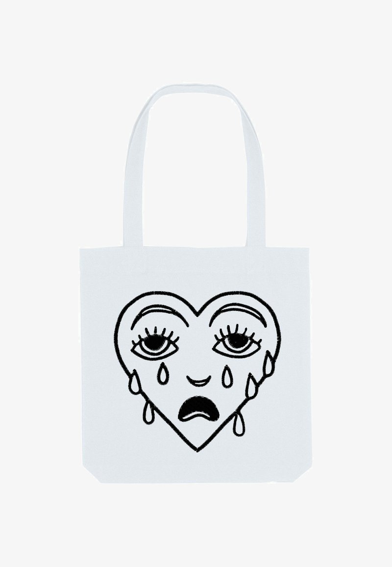 Witte tote bag met een zwart lijntekening ontwerp van een hart met twee traanvormige druppels en expressieve ogen, die een eenvoudige, platte vorm laat zien.