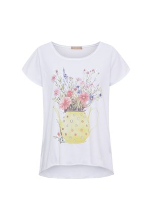 Hvid kortærmet skjorte med rund halsudskæring med farverig blomsterbuket i et print af en gul vanddunk med prikker foran.