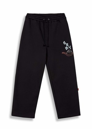 Schwarze Jogginghose mit einem elastischen Bund, Zugband und gesticktem Design, das "GRYM" und eine Teigtasche-Grafik in kontrastierenden Farben zeigt.