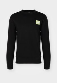 Sudadera negra de manga larga con cuello redondo, con puños y dobladillo de canalé, que presenta un pequeño logo cuadrado de color verde claro con "The North Face" en el pecho.
